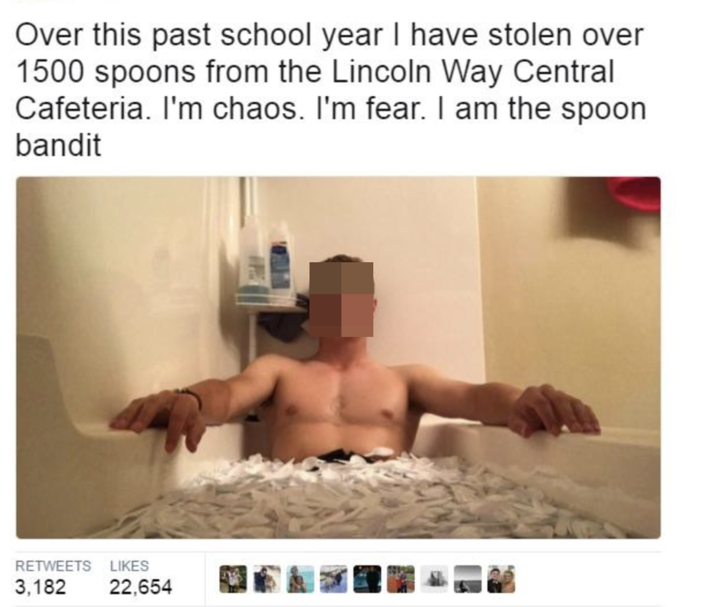 man in a tub full of plastic spoons