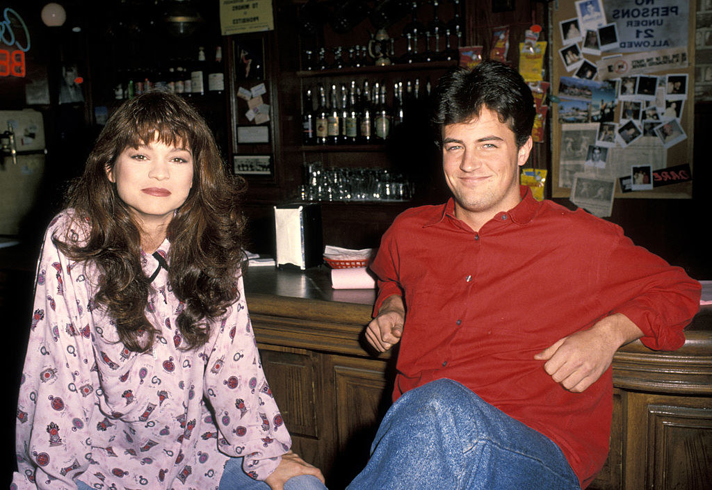 Valerie and Matthew pose for a photo as they sit at a bar