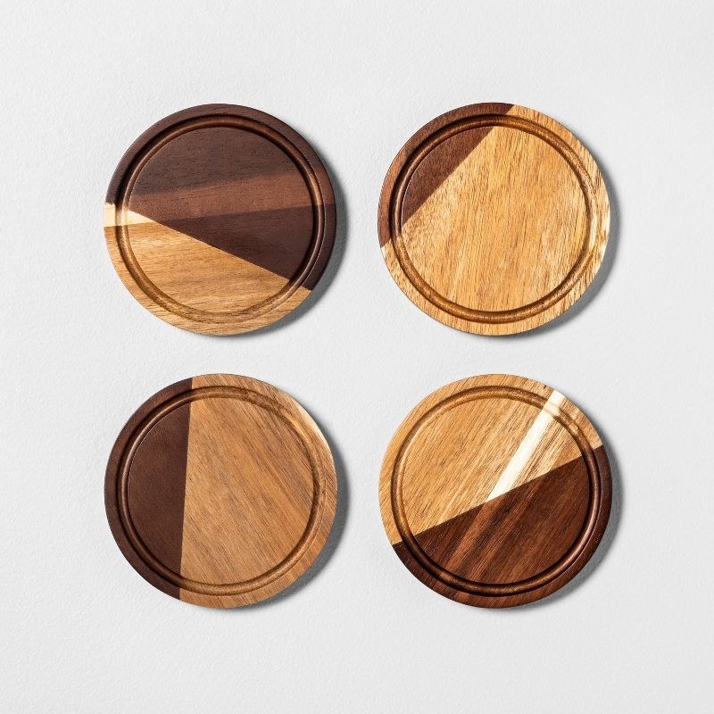 the four dark and light wood coasters