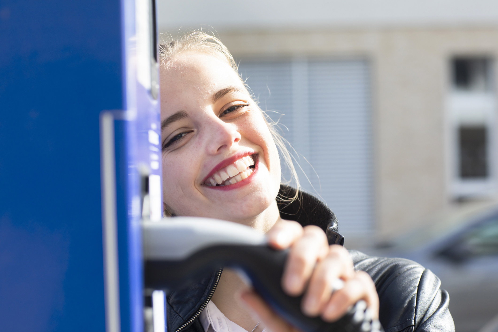 A girl smiling at the gas station