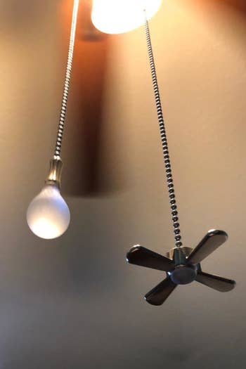 closeup of the fan and light bulb charms