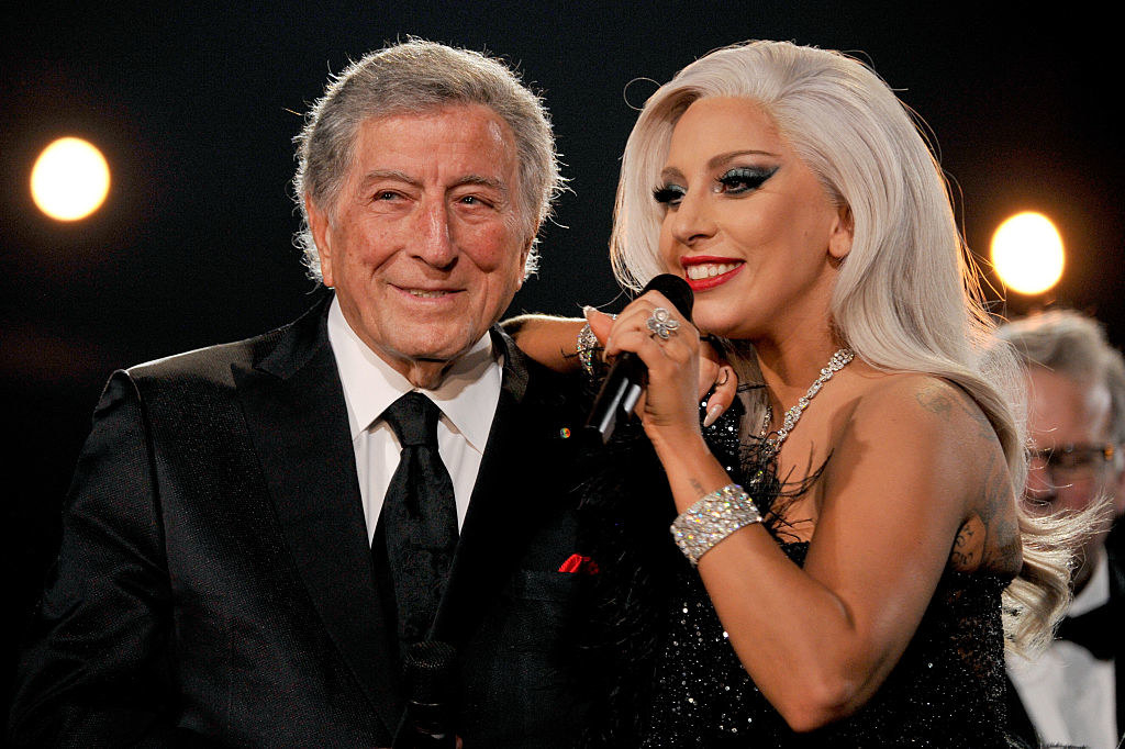 Lady Gaga and Tony Bennett stand together on stage