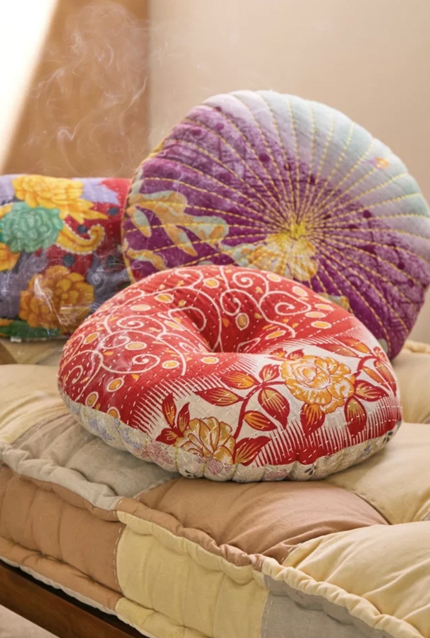 The pillows are made of stitched fabrics and pleats