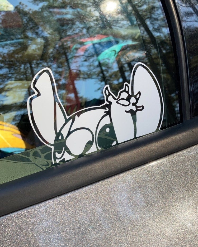 white stitch sticker on car window