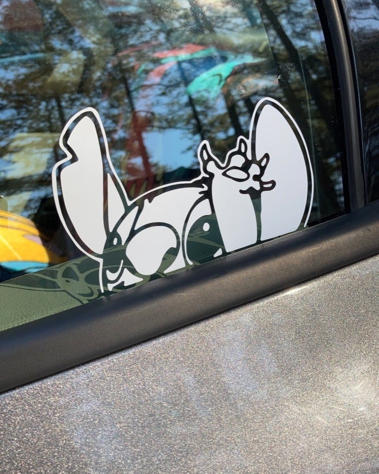 white stitch sticker on car window