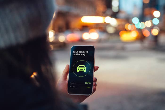 a person looking at a ride-share app on their phone