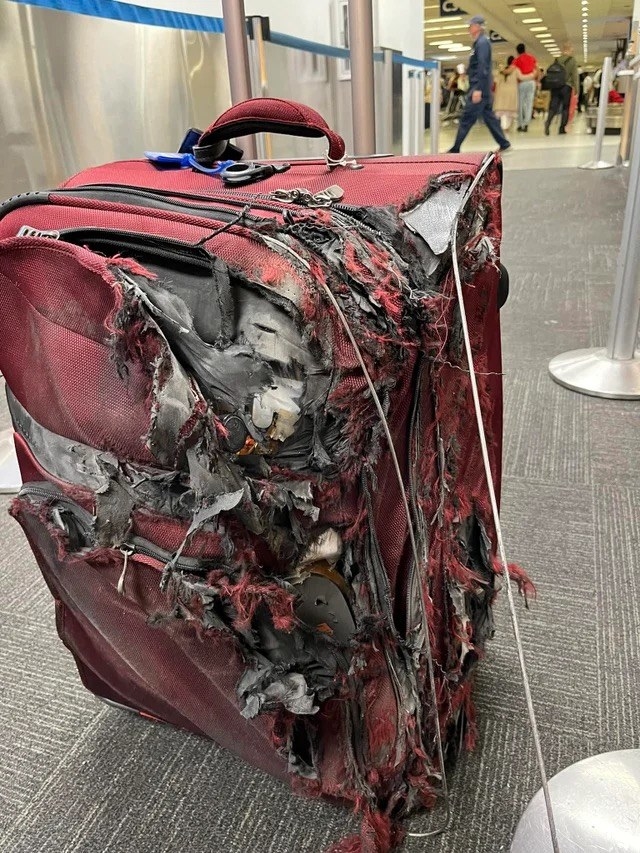 a piece of luggage that&#x27;s completely mangled