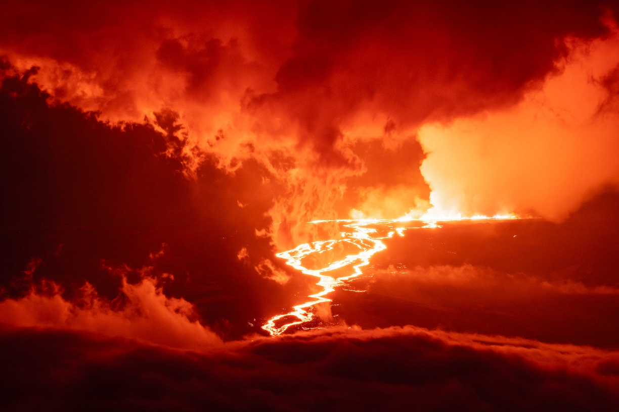 a massive orange volcano erupting