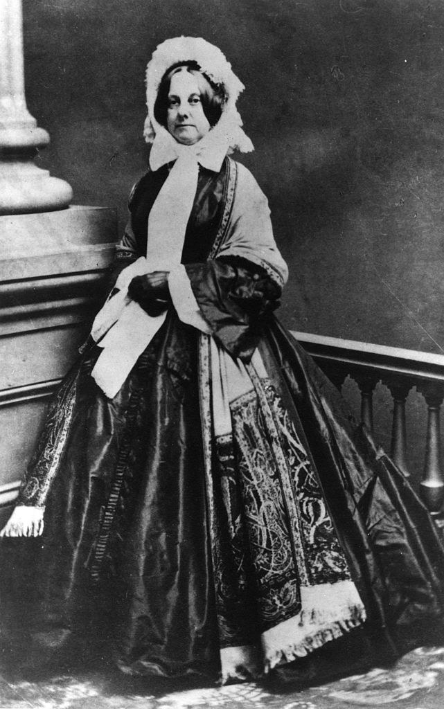 photograph of an older Powers in a large dress