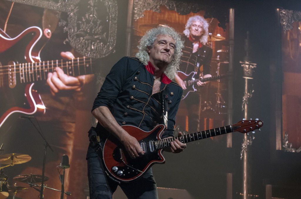 Brian May onstage performing
