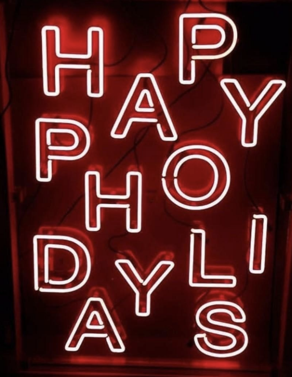 &quot;Happy holidays&quot; spelled out in neon lights in a very confusing way