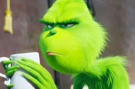 the grinch drinking a cup of coffee