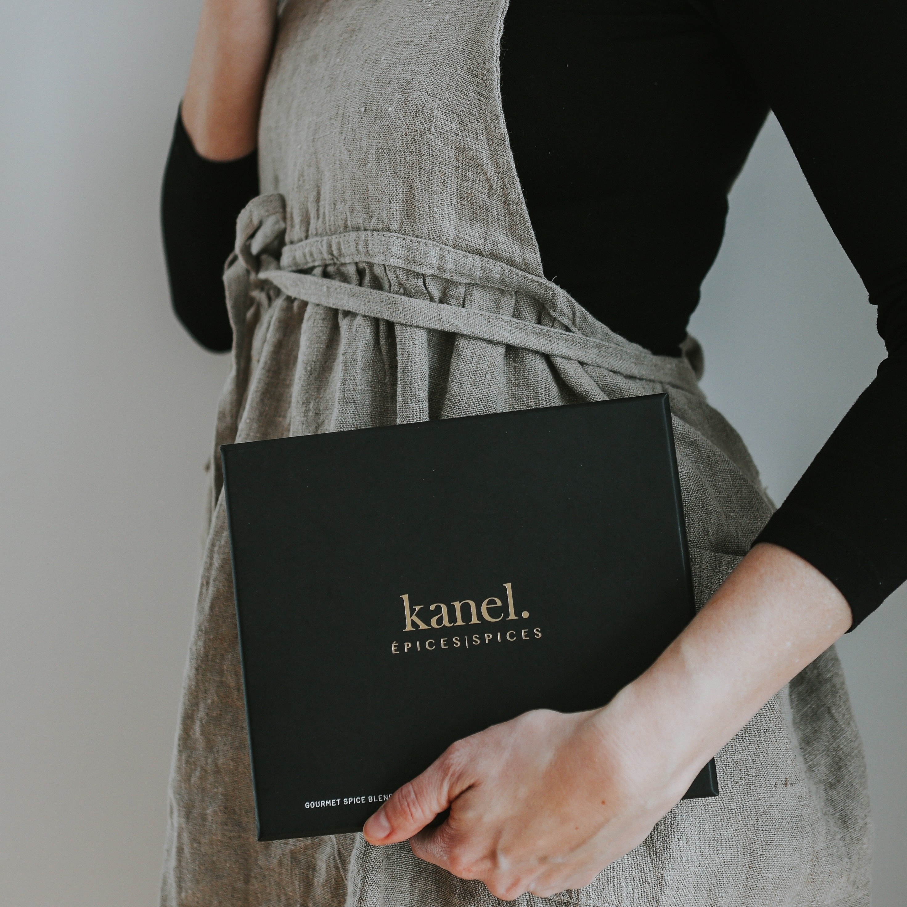 someone holding up a box of the kanel spices