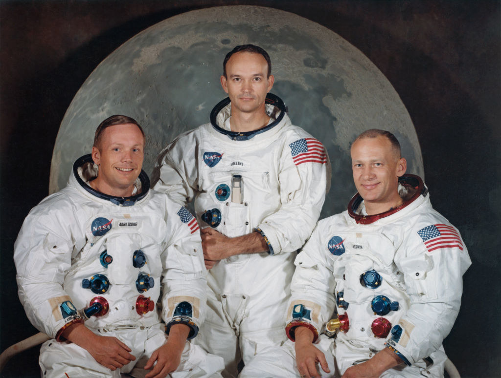 the three astronauts posing for a photo