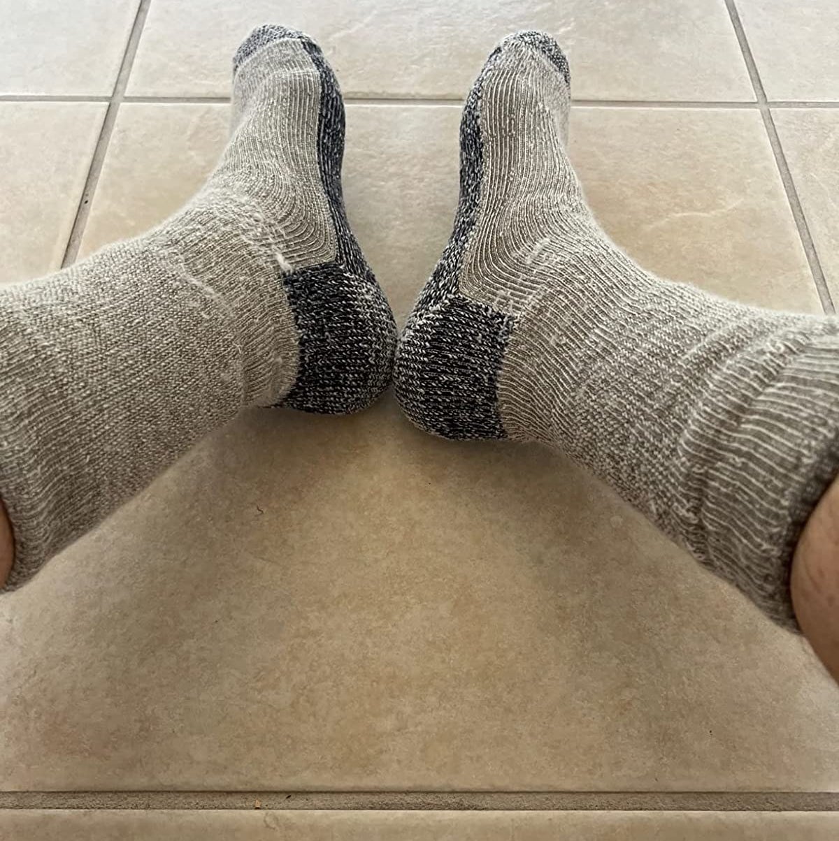 reviewer in tan and grey marled smartwool socks