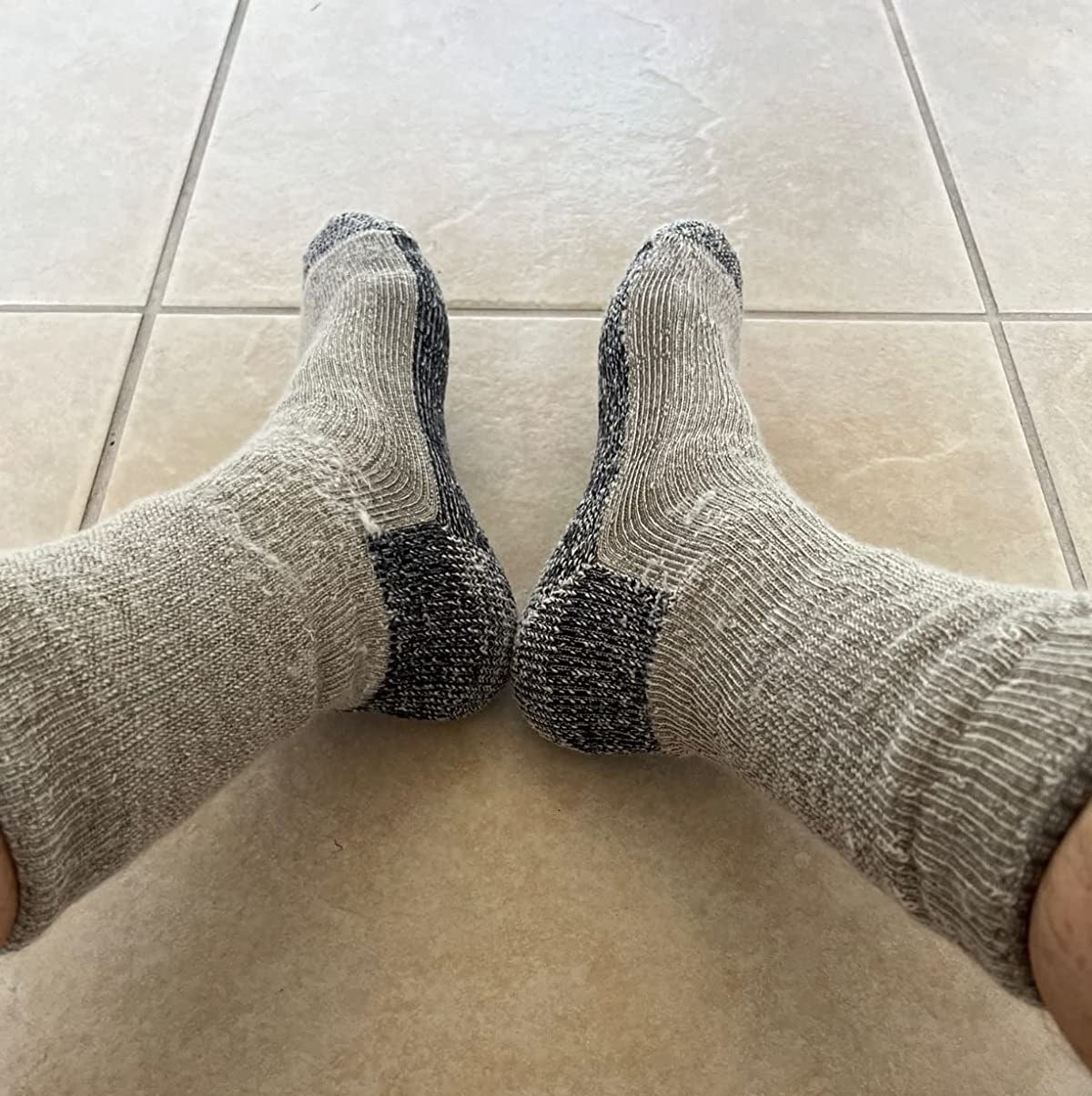 reviewer in tan and grey marled smartwool socks