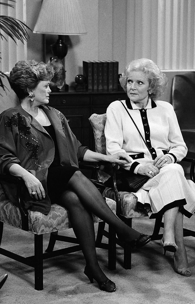 blanche and rose sitting in chairs waiting