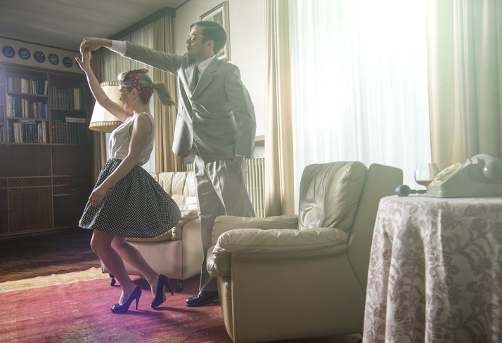 a couple dancing in their living room