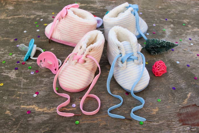 baby shoes with laces spelling out 2022