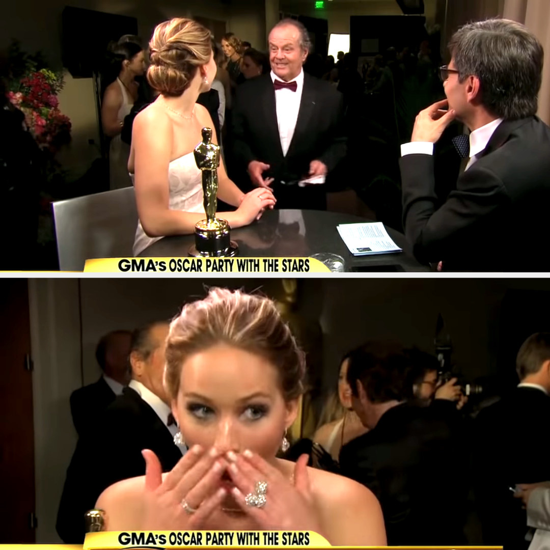 Jennifer Lawrence putting her hands over her face in awe after Jack Nicholson talked to her