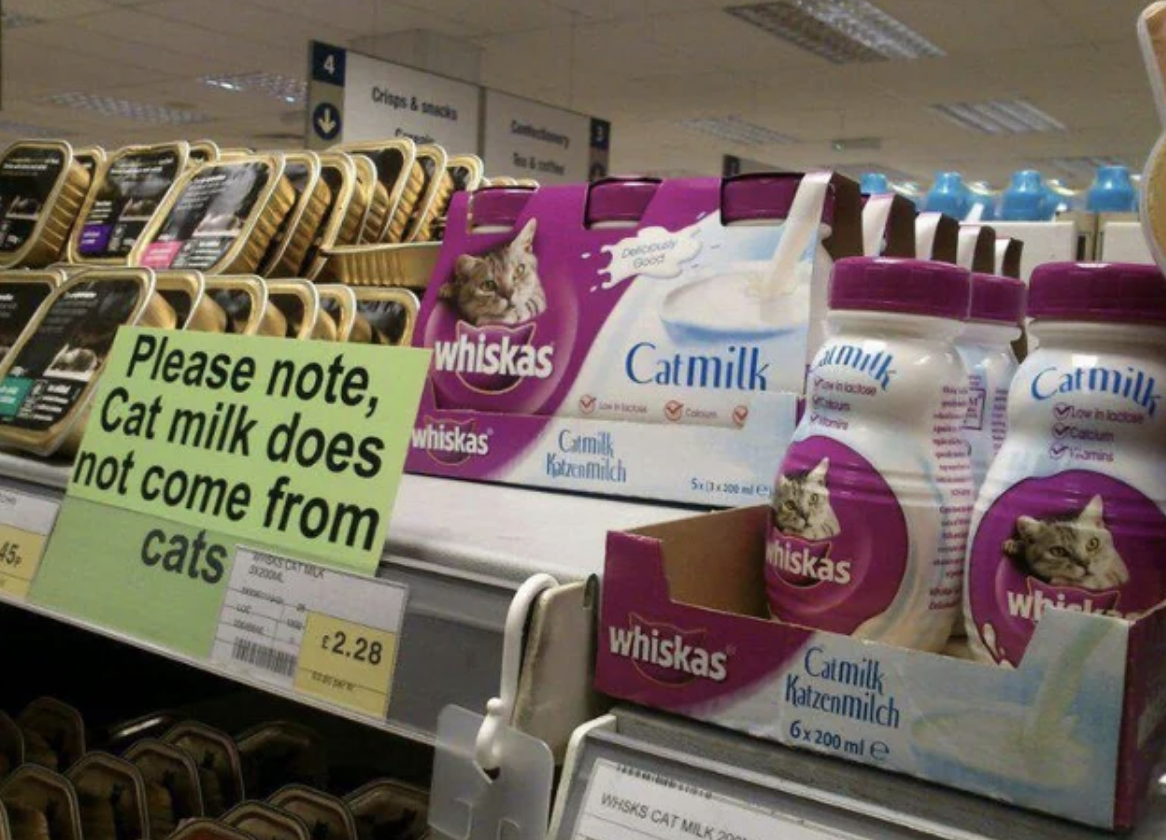 Sign says, Please note, cat milk does not come from cats