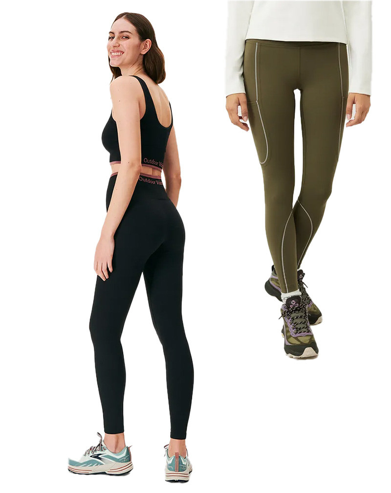 A black, ribbed pair of leggings and long line sports bra and another pair of green leggings with oval outlines in a lighter green