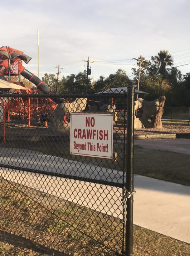a sign that says &quot;no crawfish beyond this point!&quot;