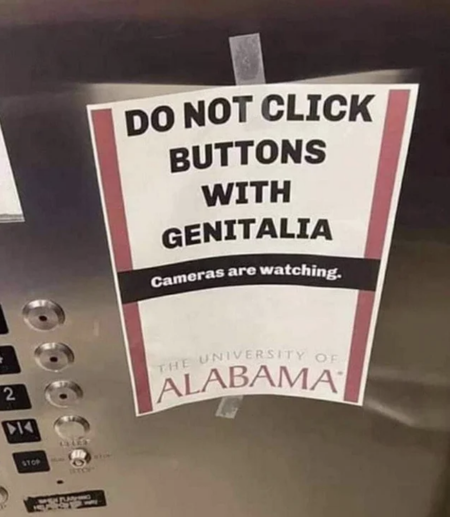 Sign says, Do not click buttons with genitalia. Cameras are watching