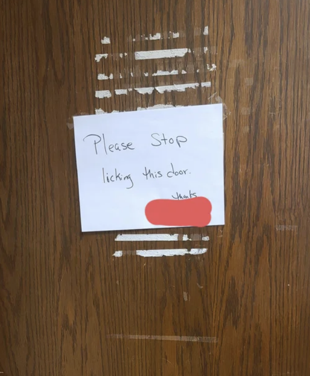 Sign says, Please stop licking this door