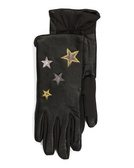 black leather gloves with stars on them