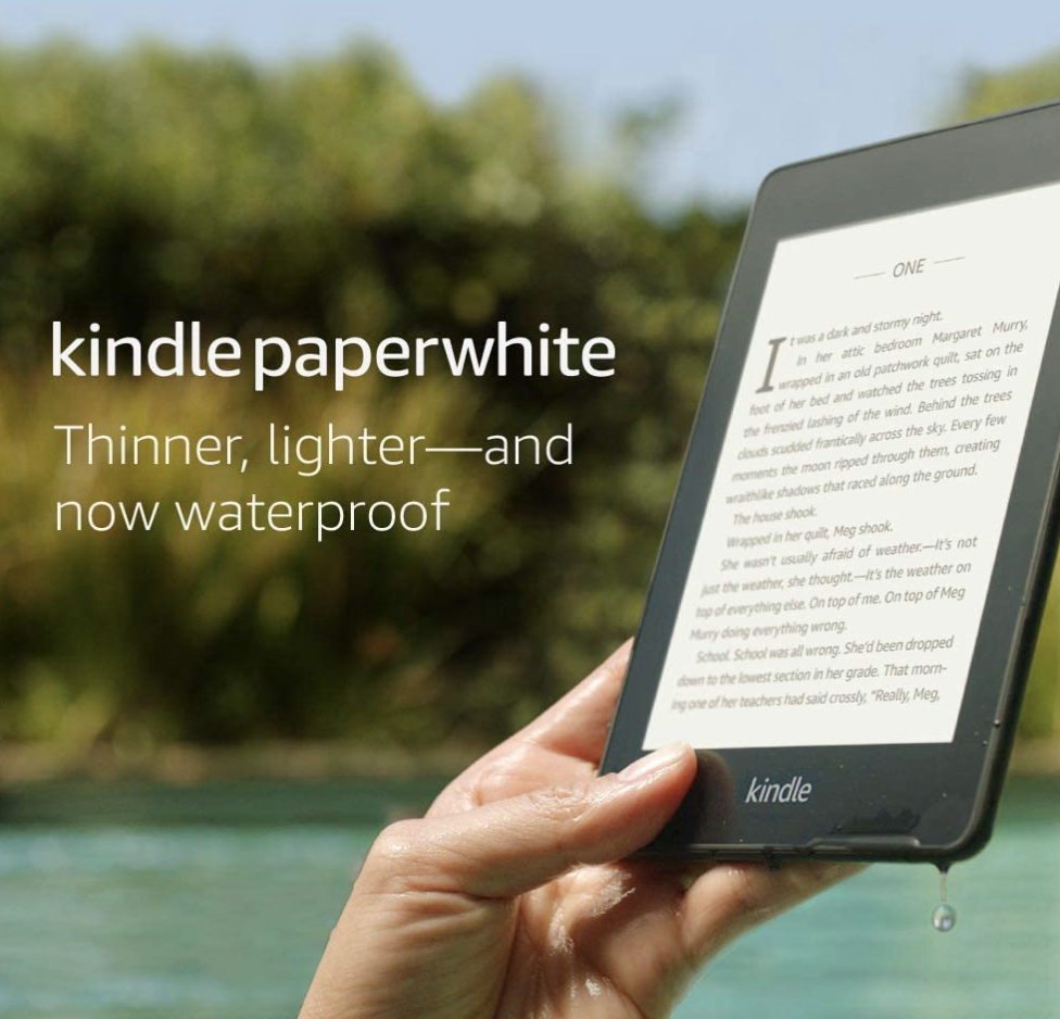 person holding kindle near pool