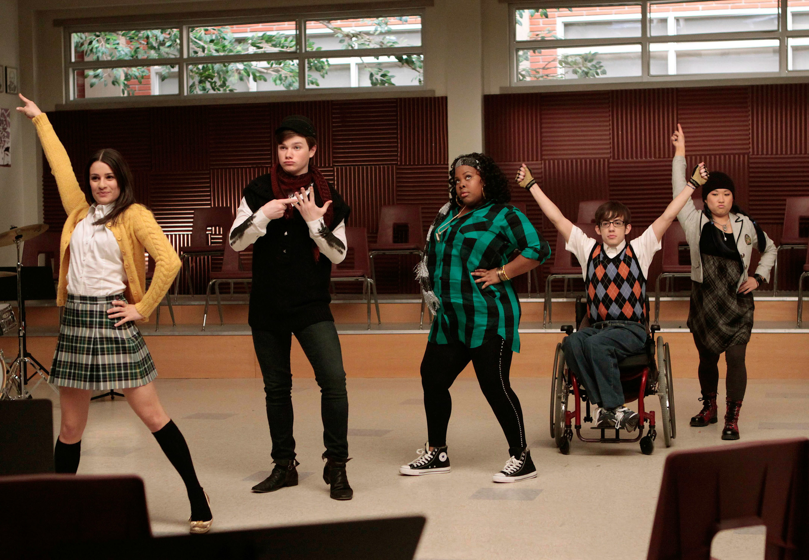 cast members dancing in the Glee rehearsal room