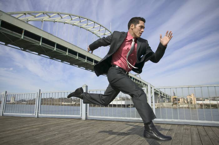 a man in a suit running