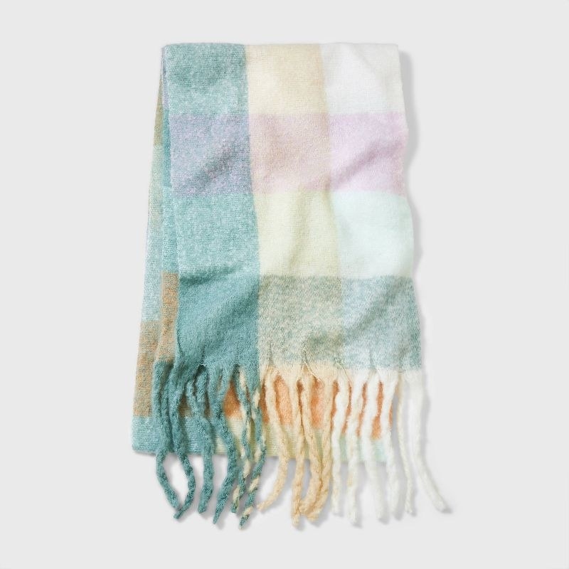 A pastel yellow green, pink, orange and white scarf