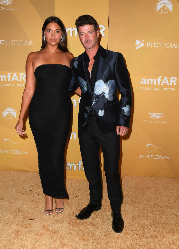 April wore a simple ankle-length strapless dress and Robin wore a floral-printed suit