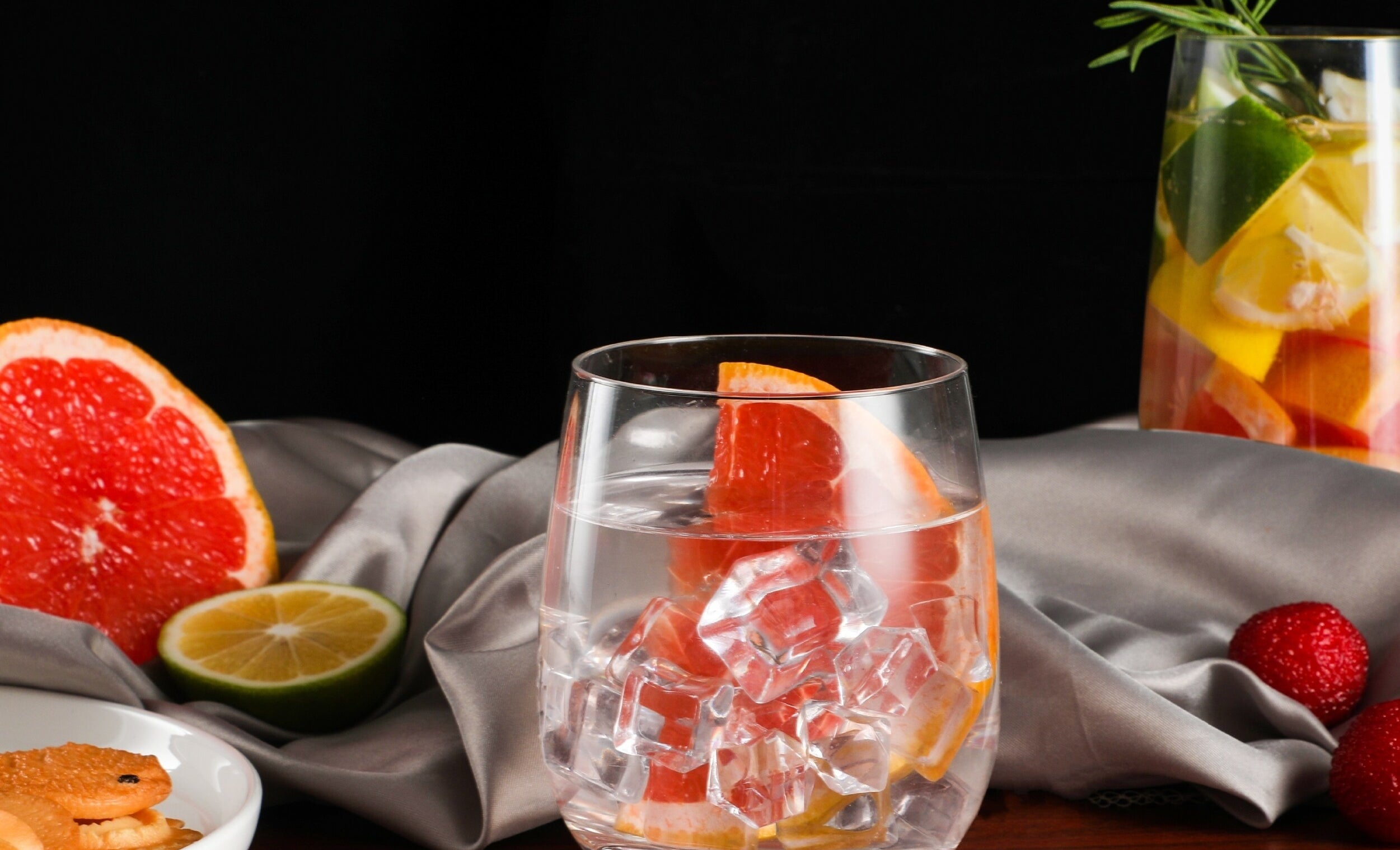 one of the glasses with ice water and a grapefruit slice in it