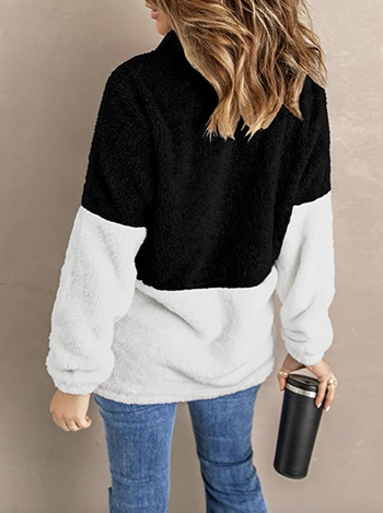 model showcasing back of black and white furry pullover