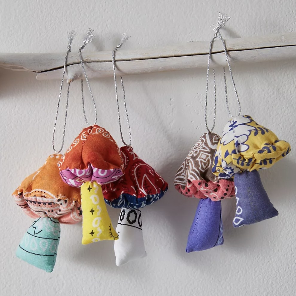 the shroom ornaments hanging on a rod