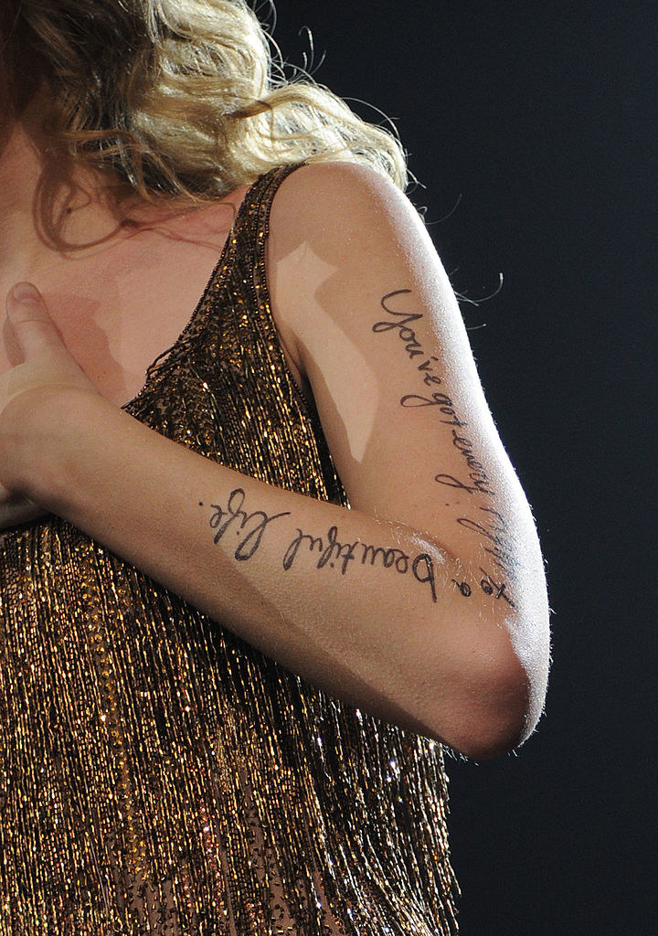 closeup of the lyrics written down taylor&#x27;s arm