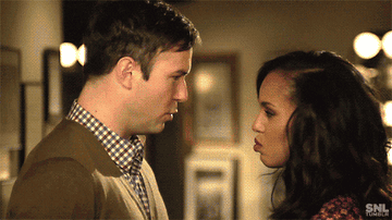 a man and a woman turning to look at the camera and saying &quot;scandal&quot; at the same time