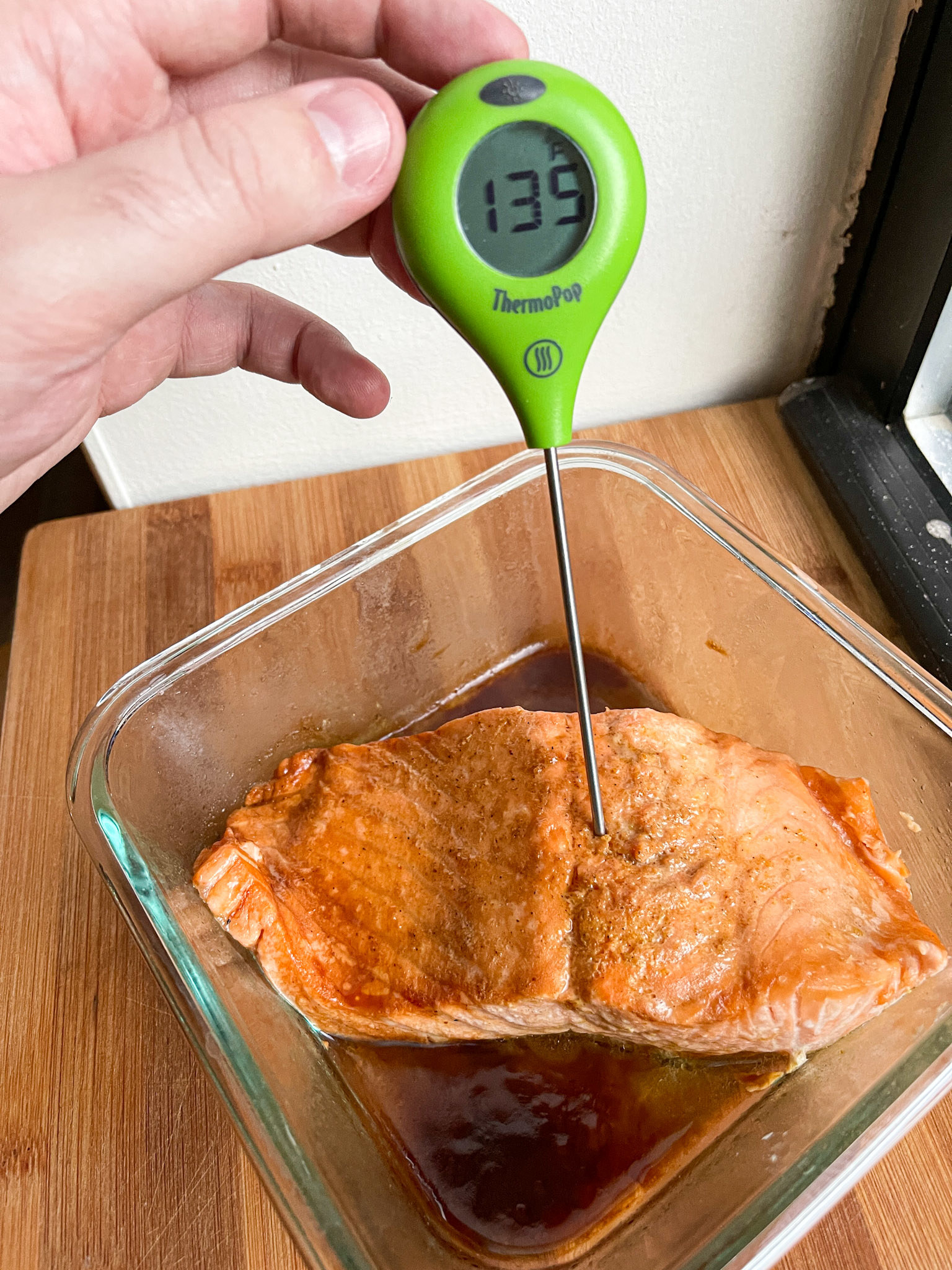 thermometer registers at 135 degrees when inserted into center of the salmon