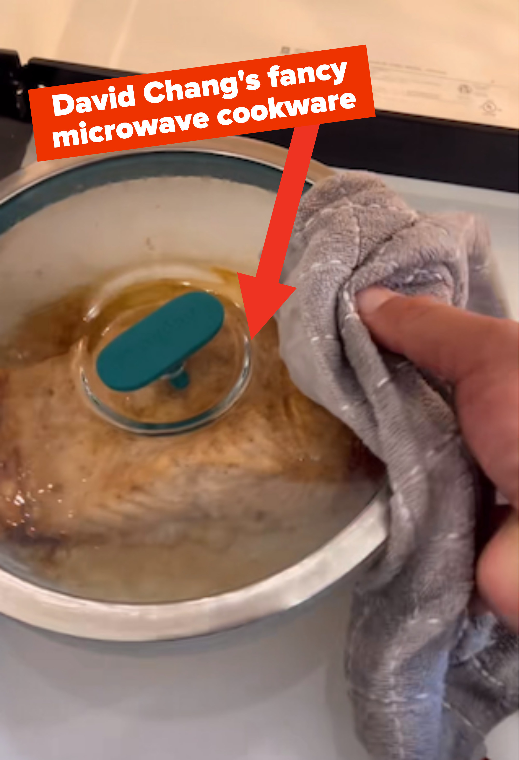 david chang taking container out of his fancy microwave