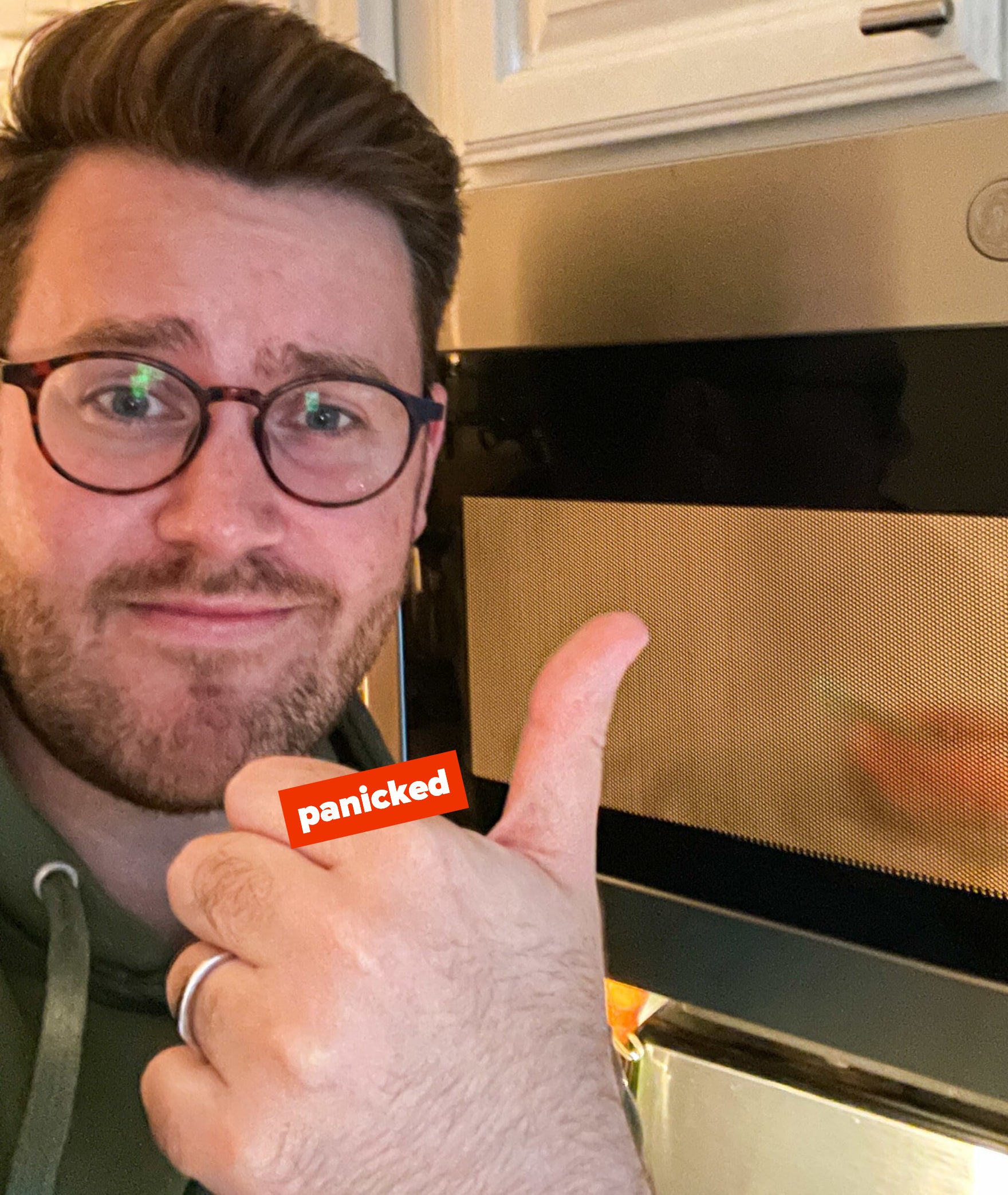 author giving a cautious thumbs up while salmon cooks