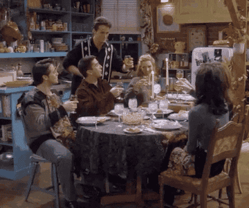 The cast of &quot;Friends&quot; does a toast before eating their Thanksgiving meal in Monica and Rachel&#x27;s kitchen
