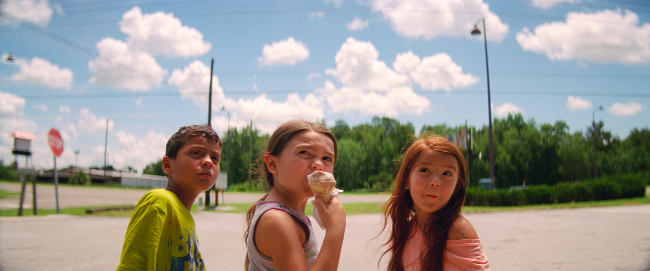 Christopher RIvera, Brooklynn Prince, and Valeria Cotto sit together with ice cream in a parking lot