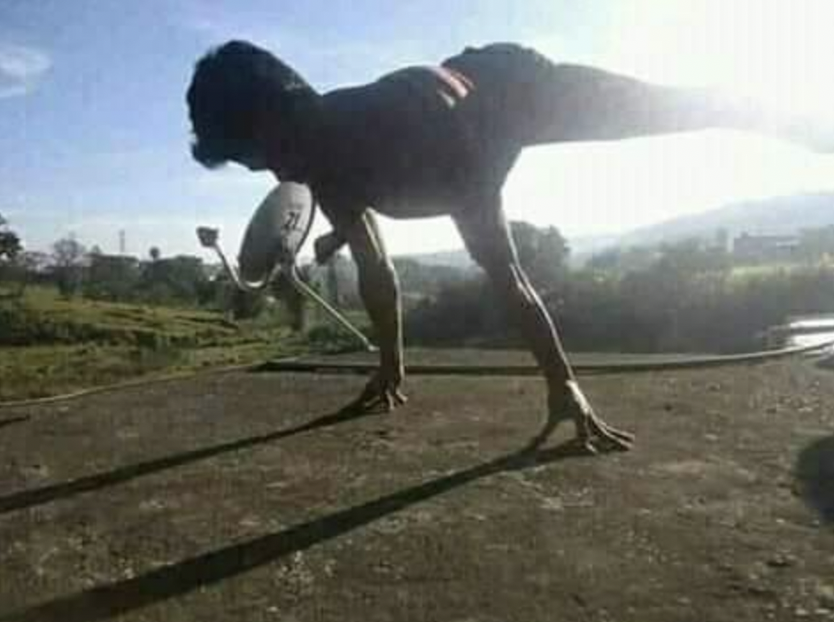 It&#x27;s a person doing gymnastics on the roof