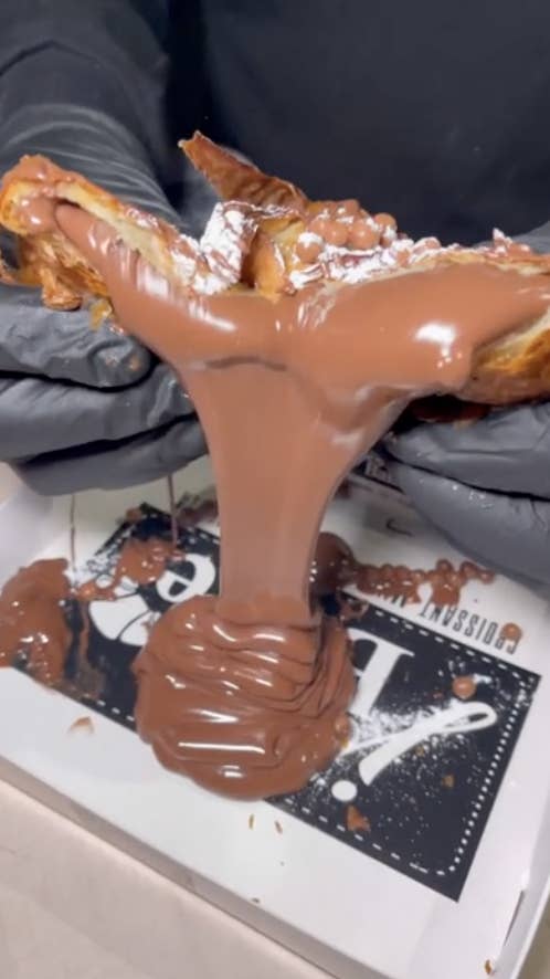 Nutella spilling out of a croissant