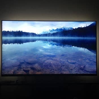 A reviewer's TV lit up by the lights