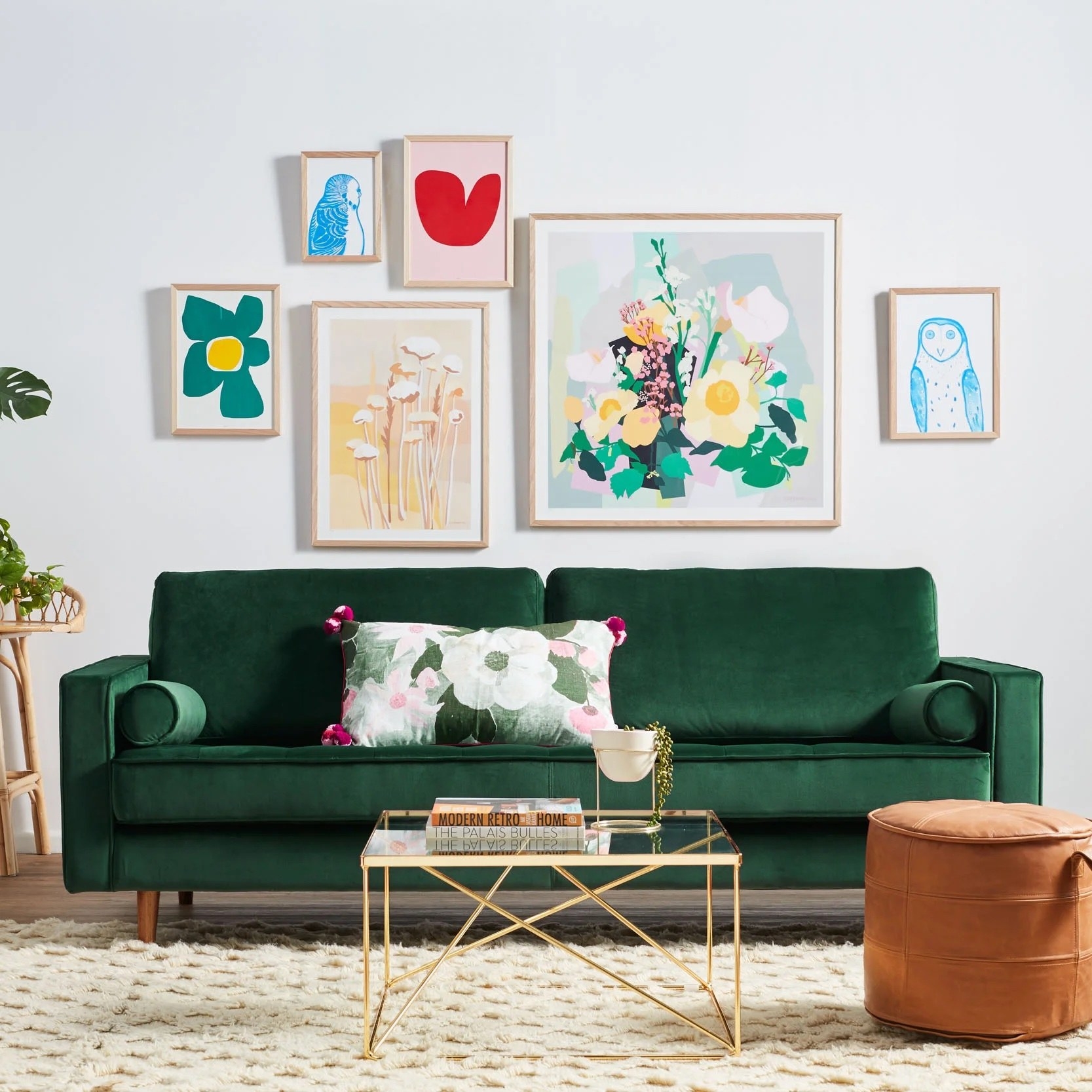 an emerald colored sofa in a modern looking living room