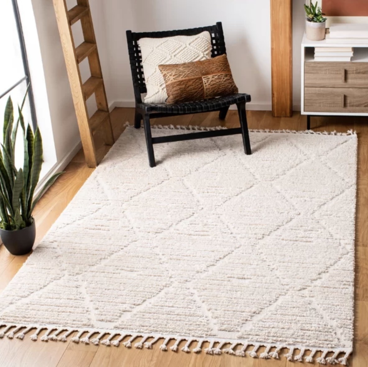 The white rug has raised plush rhombi patterns